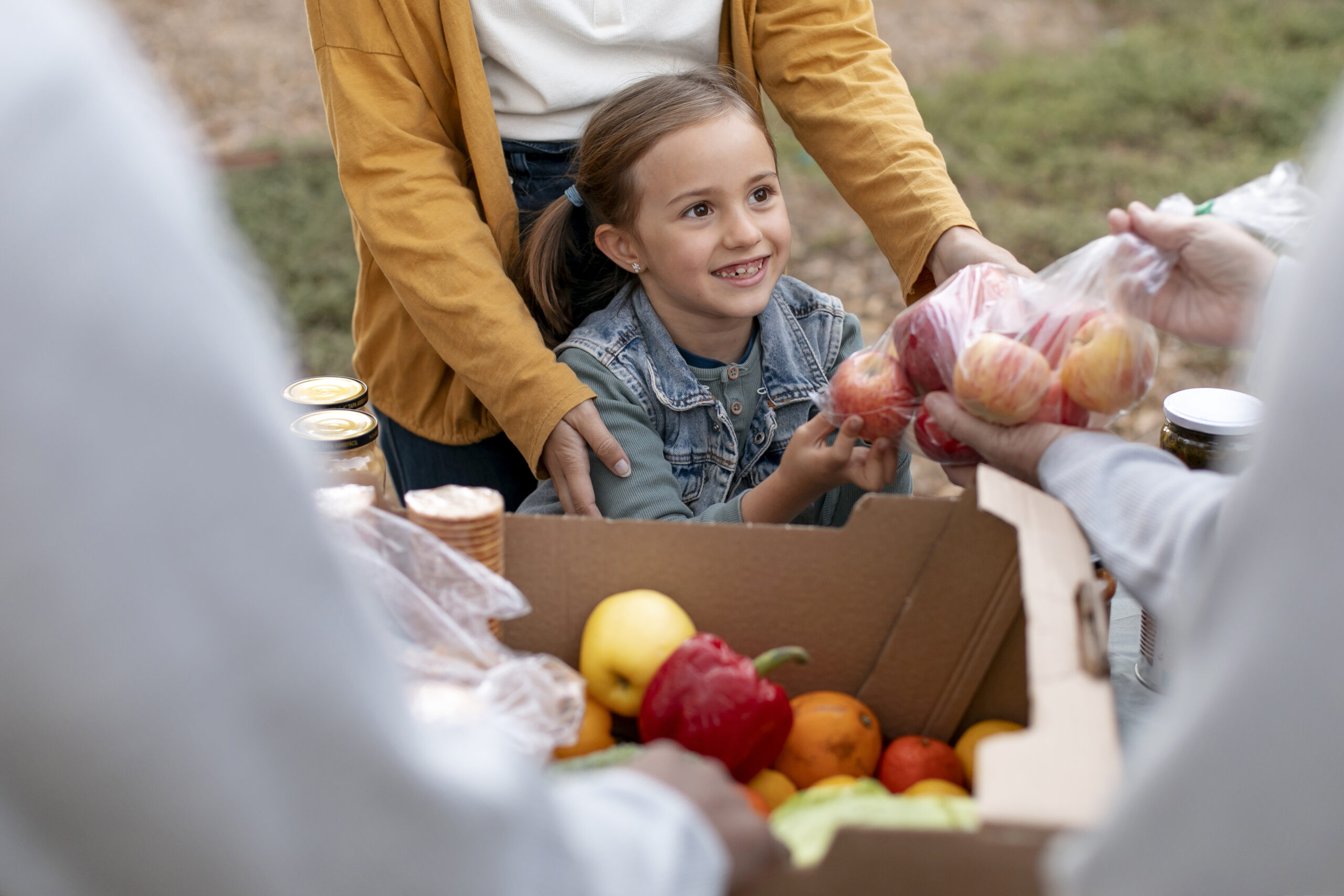 close-up-smiley-girl-getting-apples